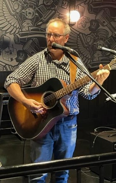 Chris Moran performing as C-Mo Muse-Ak